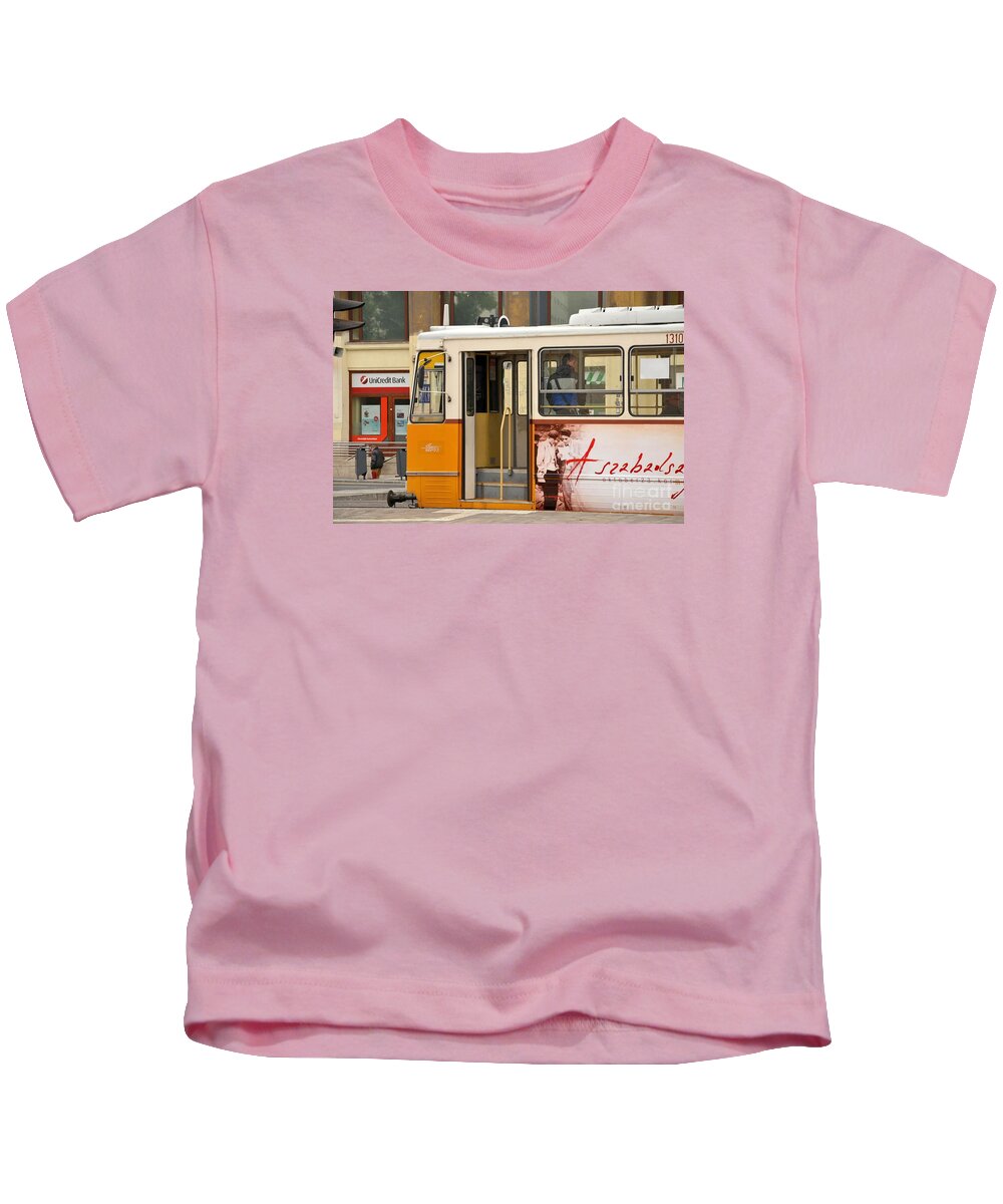 Tram Kids T-Shirt featuring the photograph A yellow tram on the streets of Budapest Hungary by Imran Ahmed