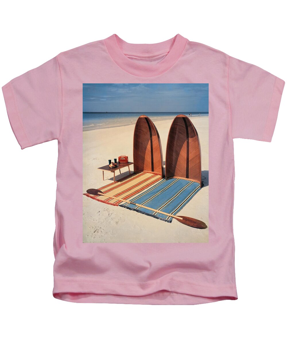 Accessories Kids T-Shirt featuring the photograph Pixie Collapsible Boat On The Beach by Lois and Joe Steinmetz