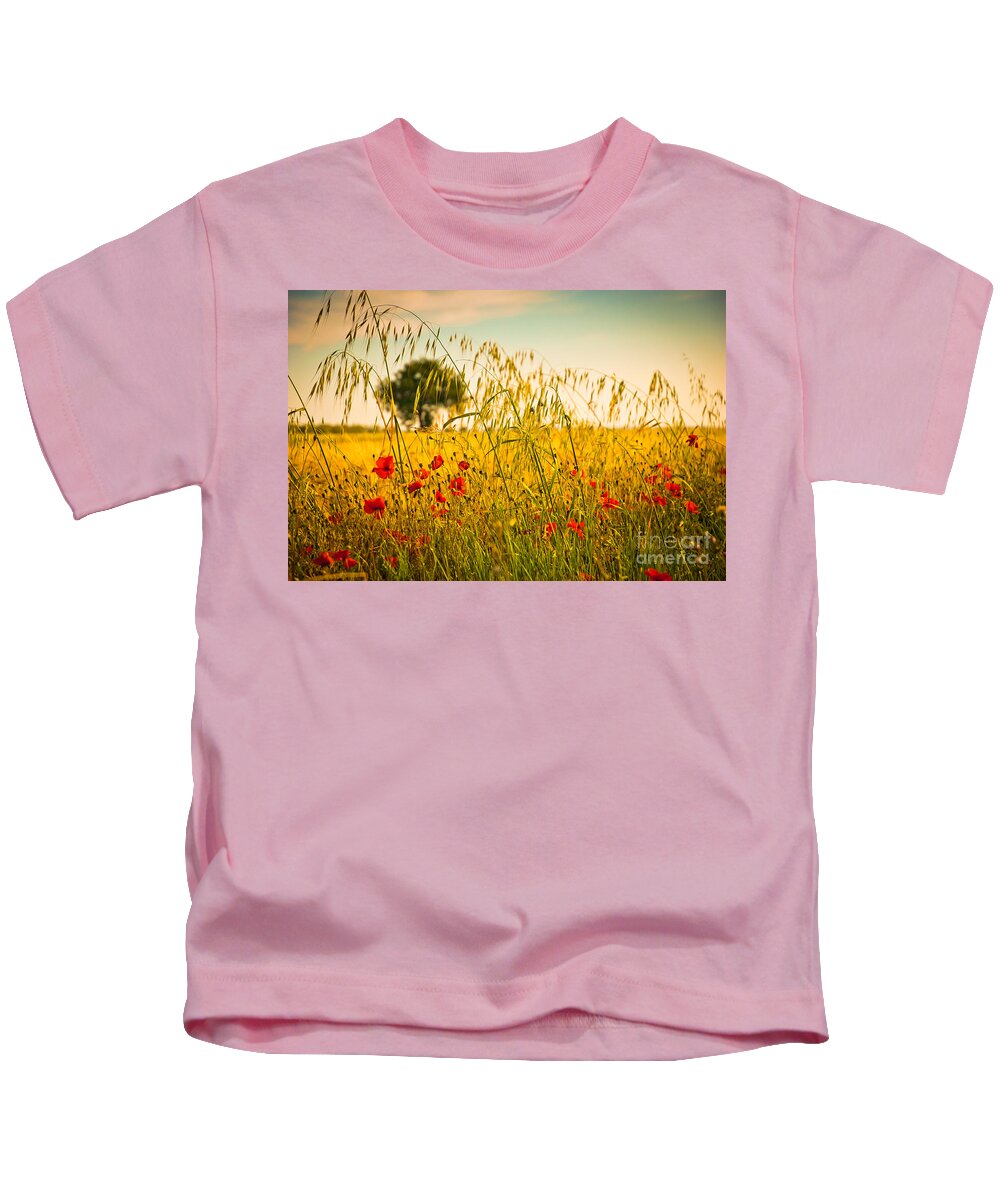 Field Kids T-Shirt featuring the photograph Poppies with tree in the distance by Silvia Ganora