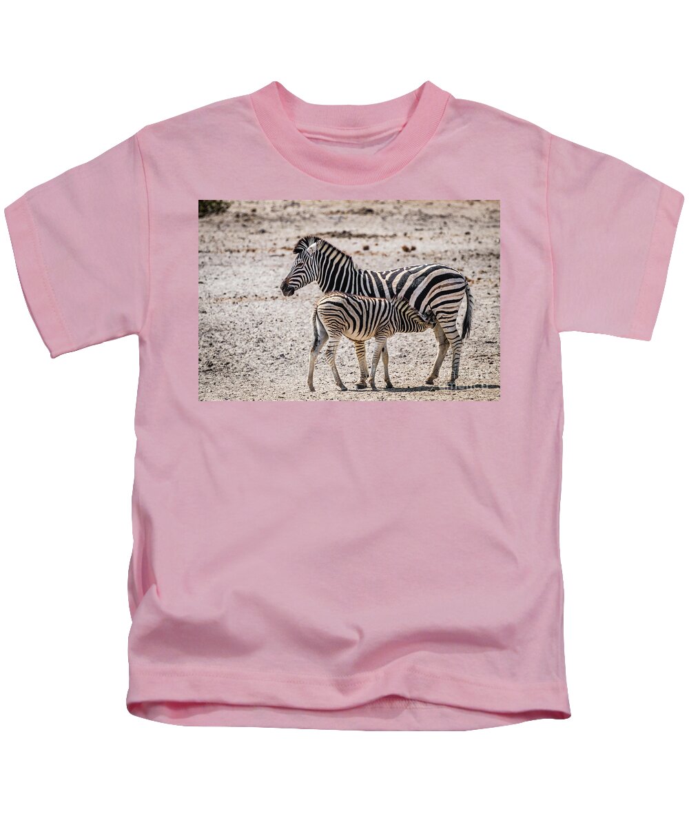 Zebra Kids T-Shirt featuring the photograph Zebra foal nursing, Namibia by Lyl Dil Creations