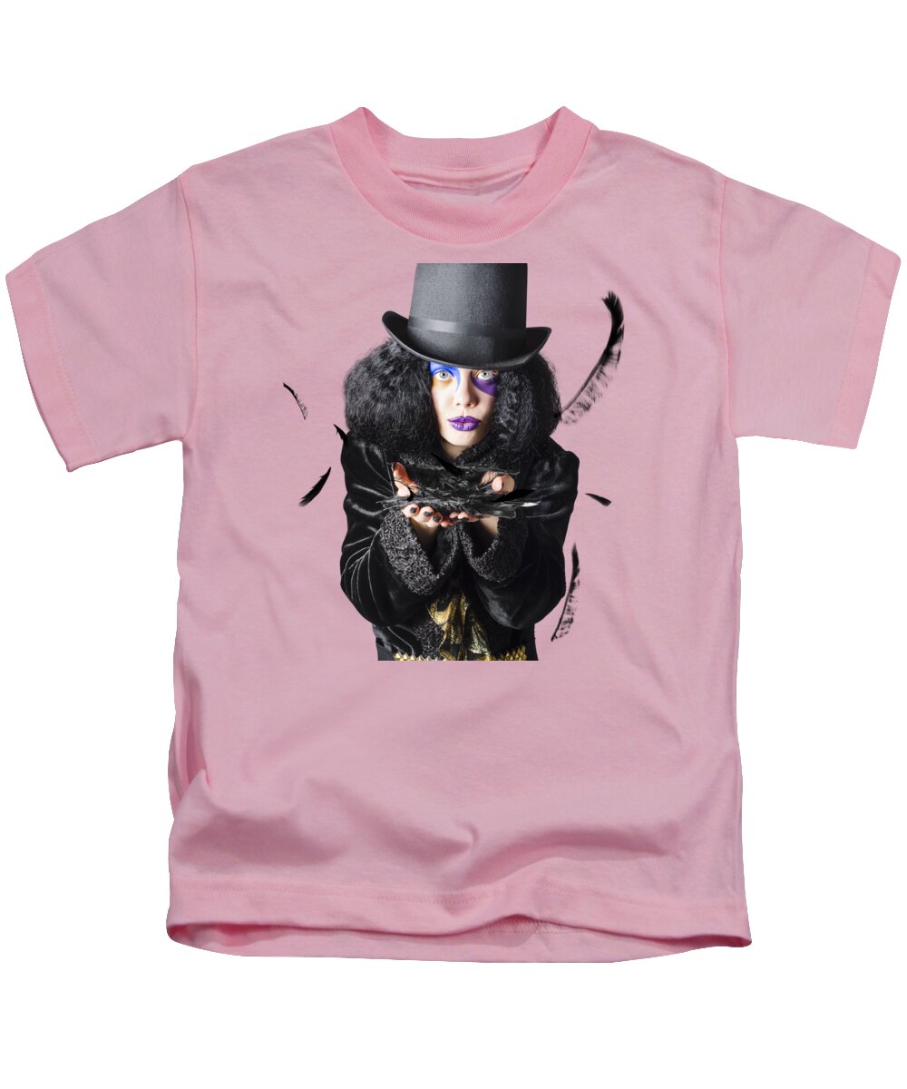 Magician Kids T-Shirt featuring the photograph Magician blowing feathers by Jorgo Photography