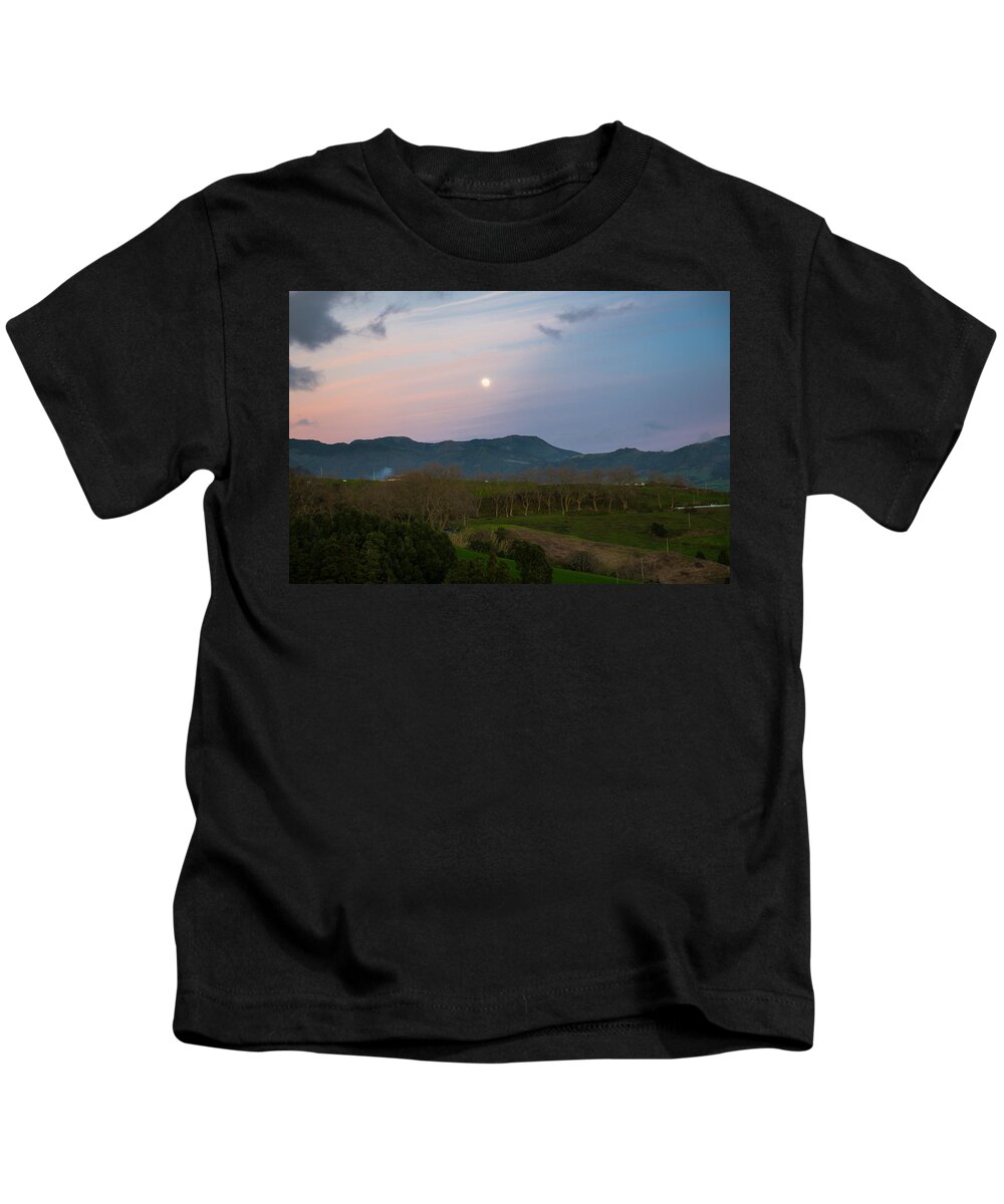 Art Kids T-Shirt featuring the photograph Moon over the Hills of Povoacao #1 by Joseph Amaral