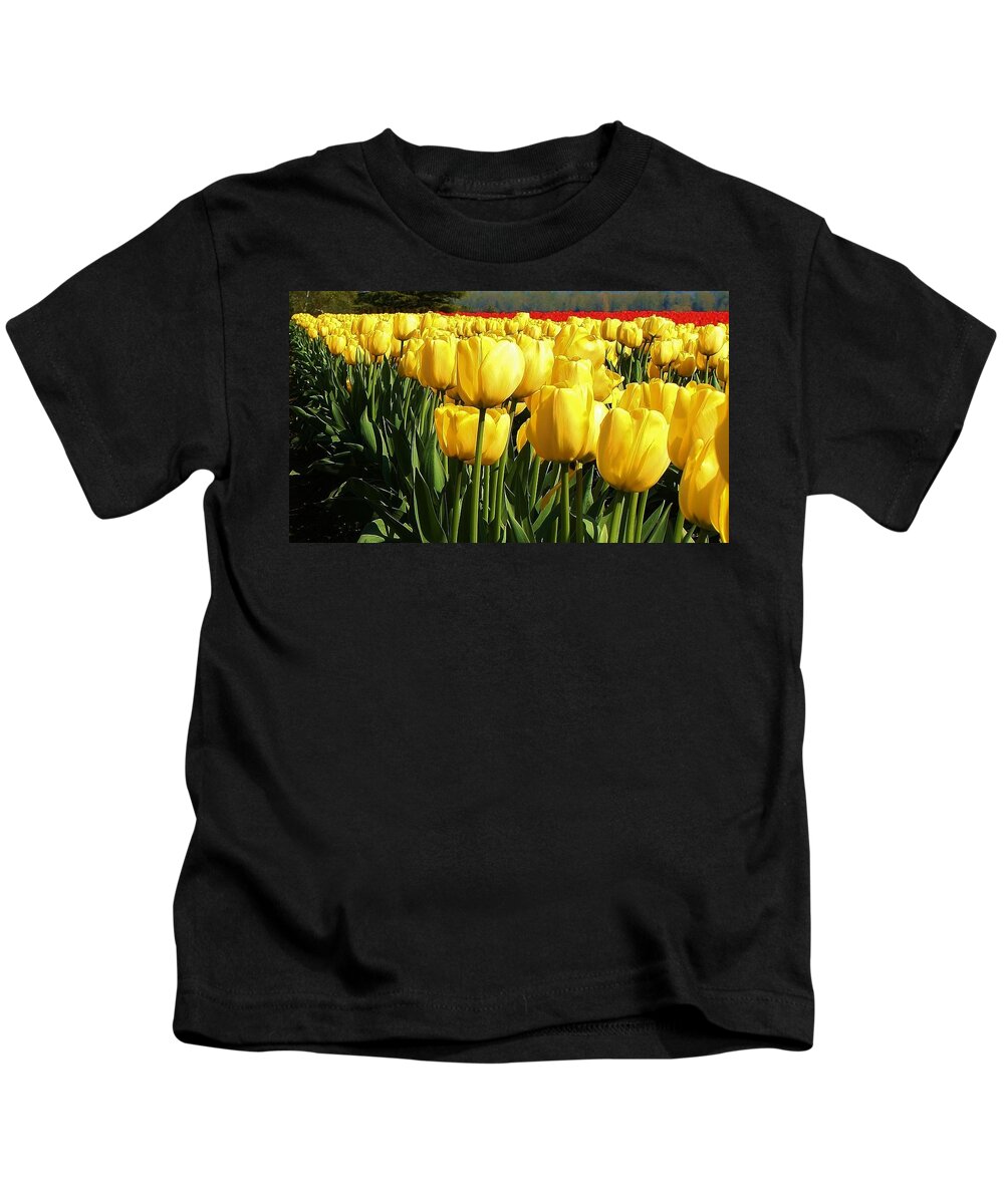 Flora Kids T-Shirt featuring the photograph Tip Toe through the Tulips #2 by Bruce Bley