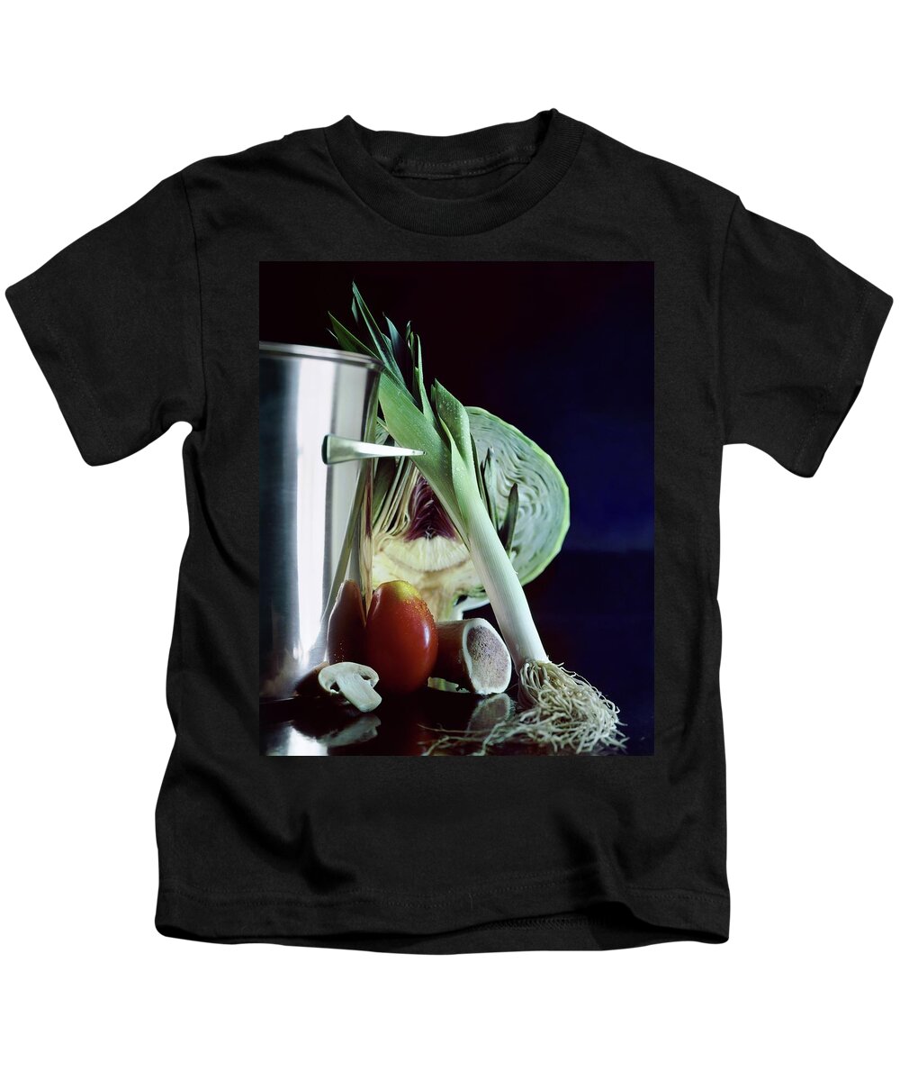 Still Life Kids T-Shirt featuring the photograph A Pot With Assorted Vegetables by Fotiades