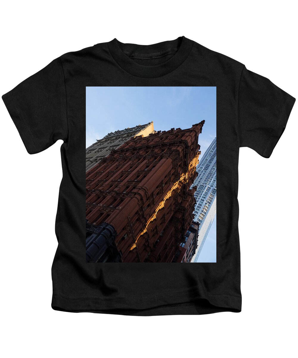 Slice Kids T-Shirt featuring the photograph A Warm Slice of Sunshine - Manhattan's Potter Building at Sunrise by Georgia Mizuleva