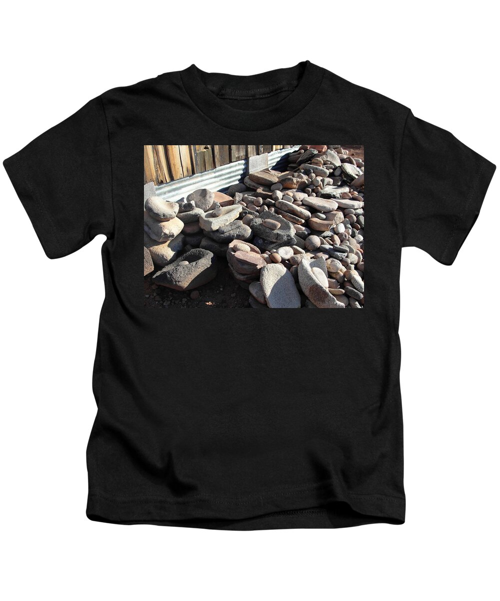 Grinding Stones Kids T-Shirt featuring the photograph Daily Grind by Natalie Ortiz