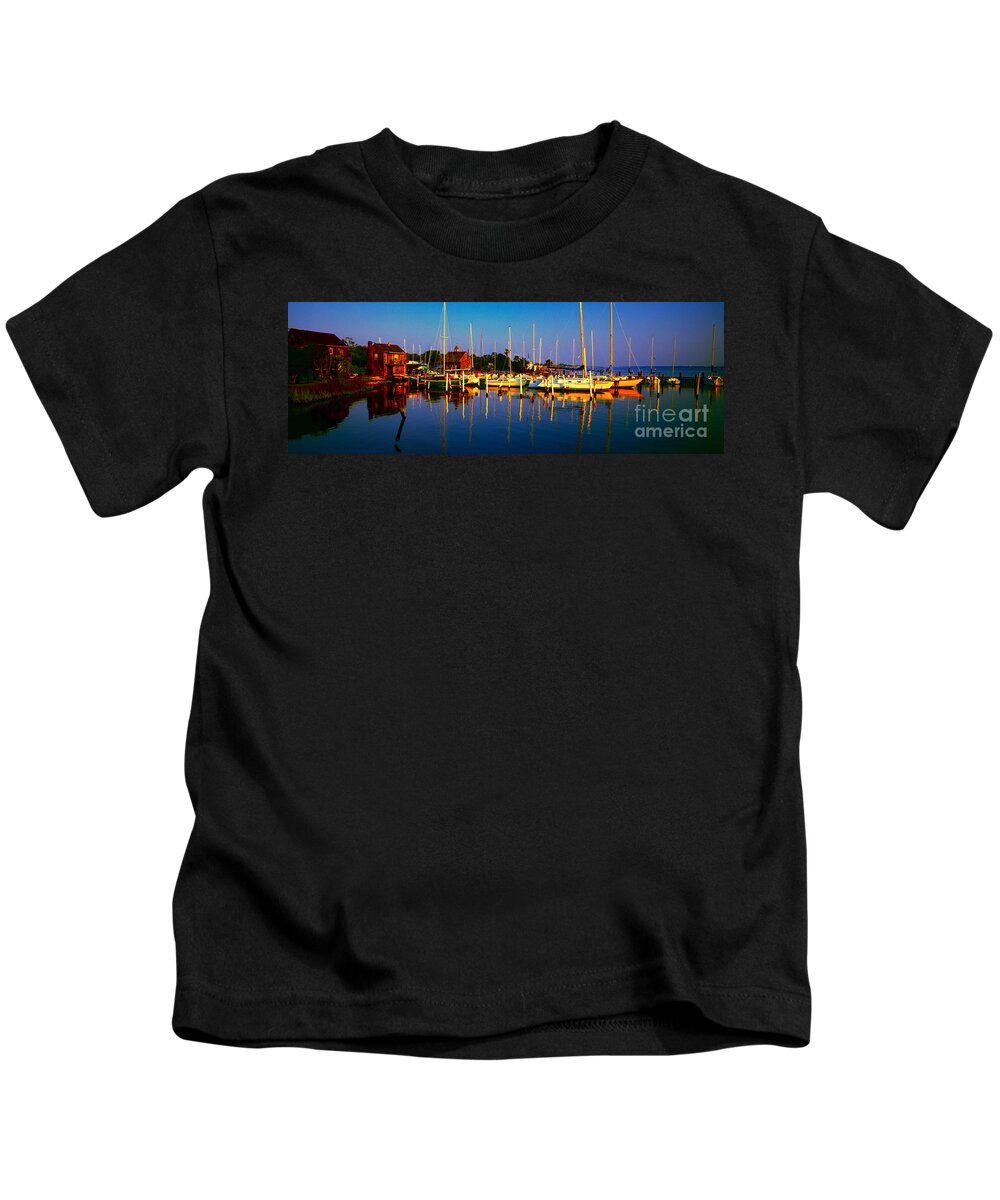 Florida Kids T-Shirt featuring the photograph Daytona Beach Florida inland waterway private boat yard with bird  by Tom Jelen