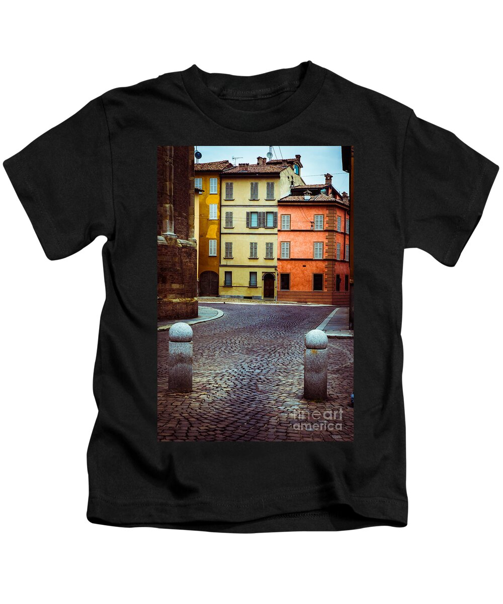 Cobbled Kids T-Shirt featuring the photograph Deserted street with colored houses in Parma Italy by Silvia Ganora