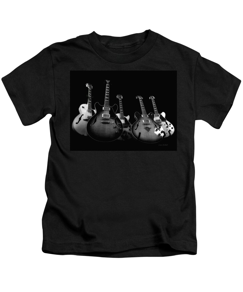 Guitar Kids T-Shirt featuring the photograph Instrumental Change by Donna Blackhall