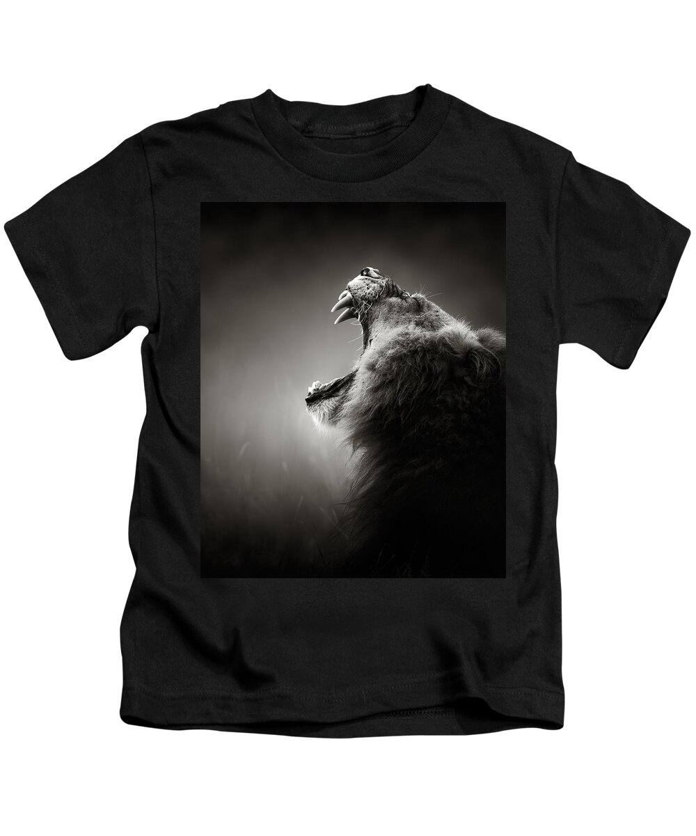 Lion Kids T-Shirt featuring the photograph Lion displaying dangerous teeth by Johan Swanepoel
