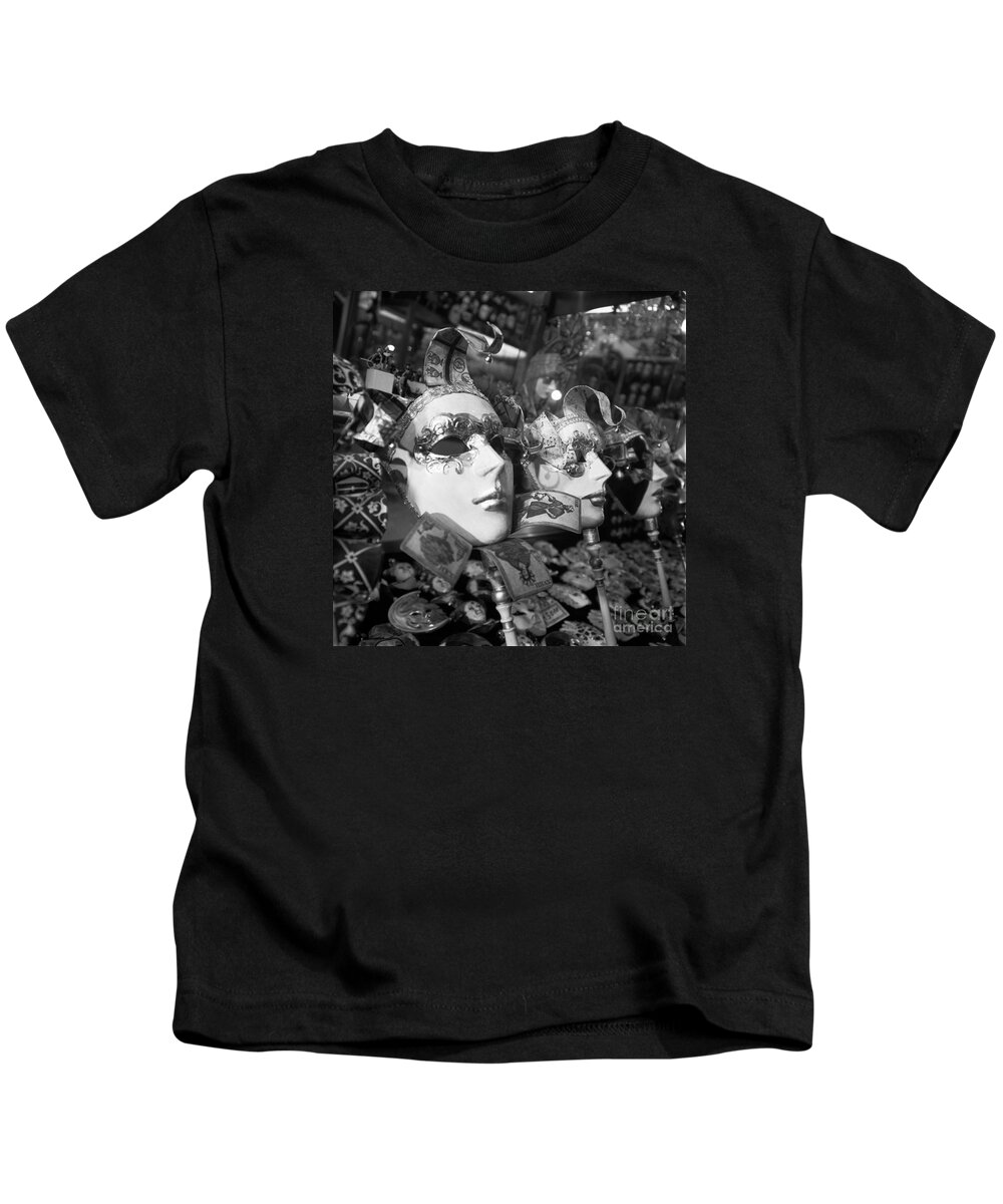 Masks Kids T-Shirt featuring the photograph Masks in shop window by Riccardo Mottola