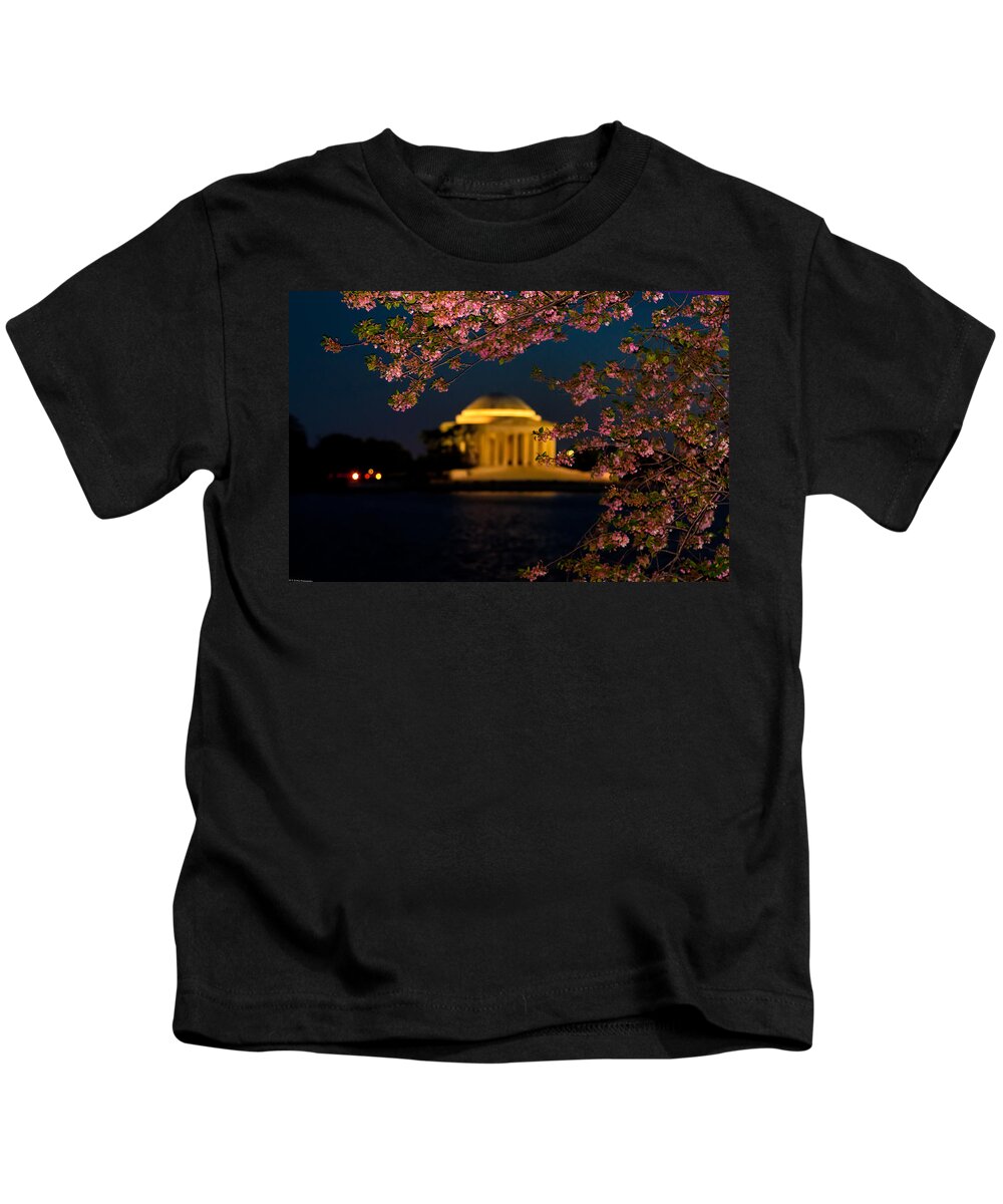 America Kids T-Shirt featuring the photograph Night View of Cherry Blossoms and the Jefferson Memorial by Mitchell R Grosky