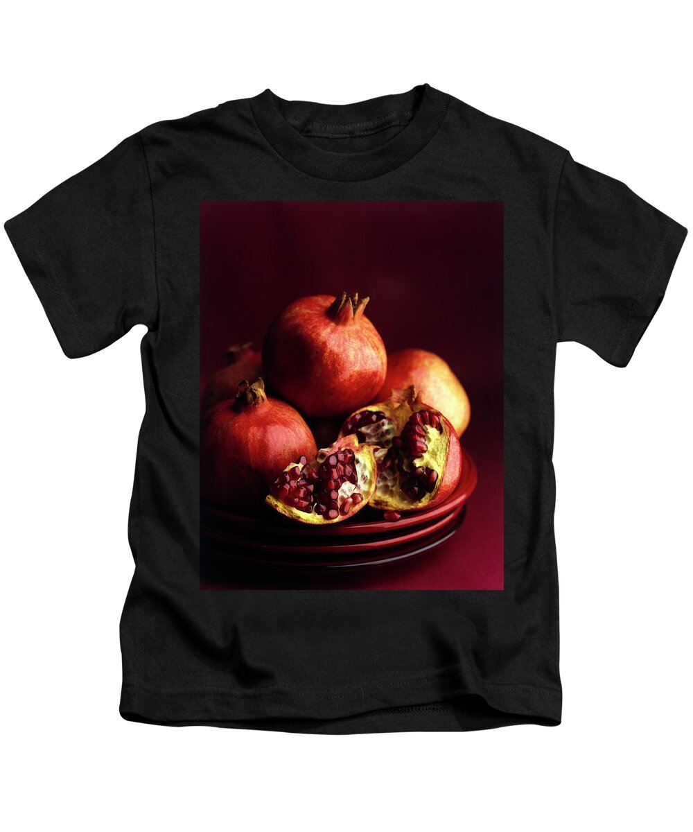 Fruits Kids T-Shirt featuring the photograph Pomegranates by Romulo Yanes