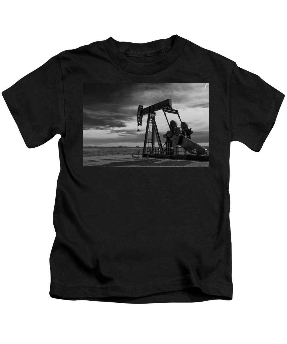 Oil Kids T-Shirt featuring the photograph Pumpjack at Work Near Denver International Airport by Tony Hake