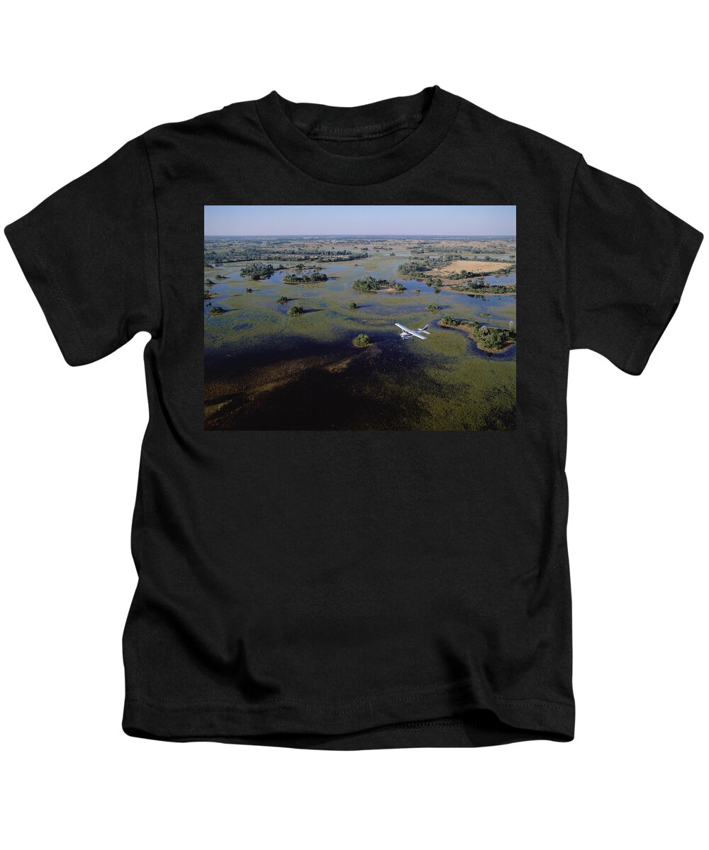 Feb0514 Kids T-Shirt featuring the photograph Safari Airplane Flying Over Okavango by Konrad Wothe
