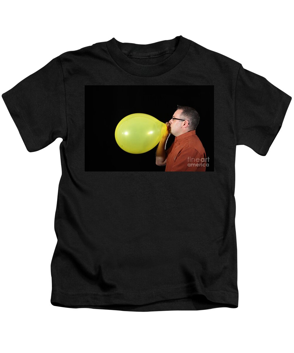 Person Kids T-Shirt featuring the photograph Man Inflating Balloon #2 by Ted Kinsman