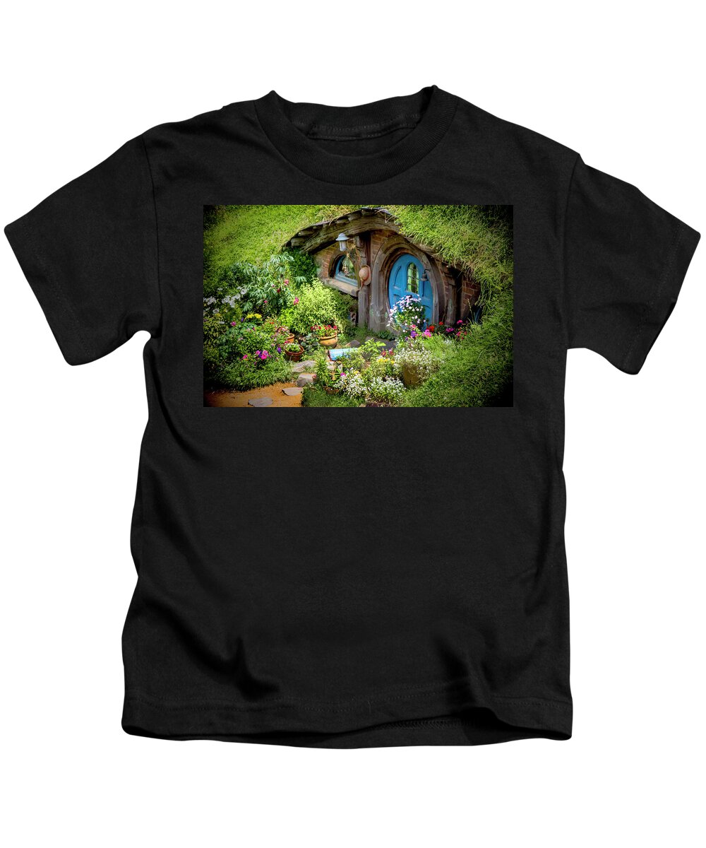 Hobbits Kids T-Shirt featuring the photograph A Pretty Hobbit Hole by Kathryn McBride