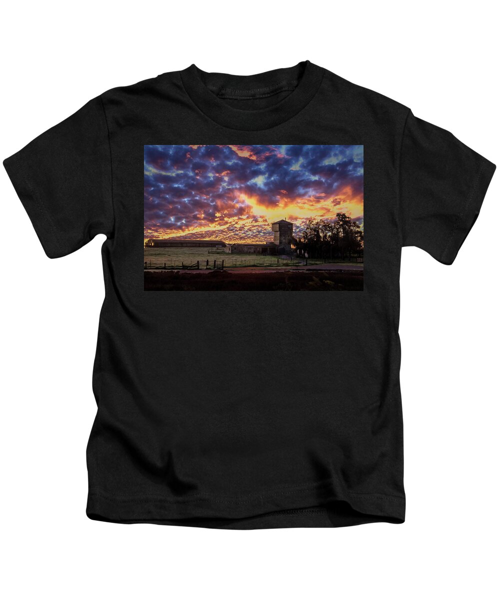 Clouds Kids T-Shirt featuring the photograph Angry Sunrise by Bruce Bottomley