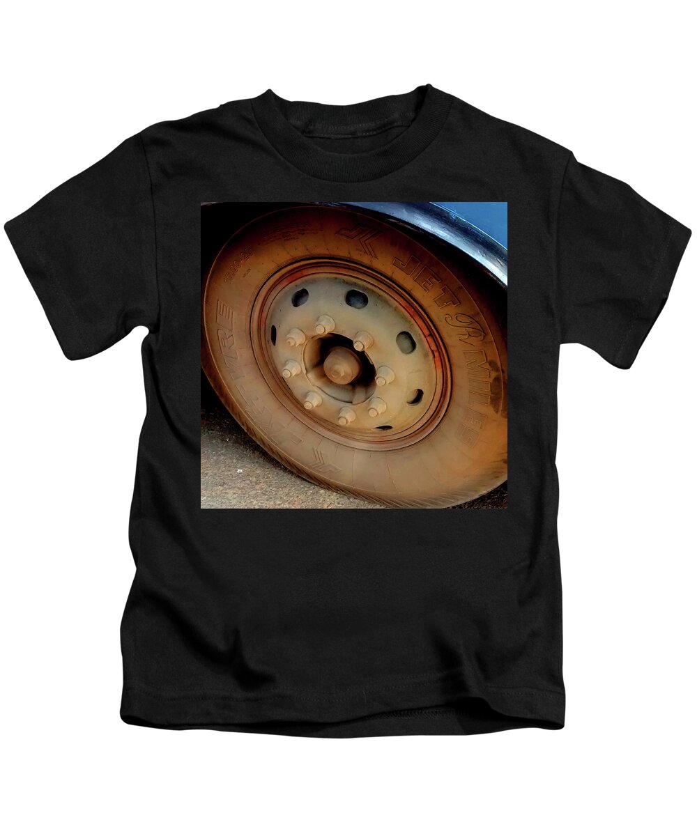 India Kids T-Shirt featuring the photograph Bus Tyre by Misentropy