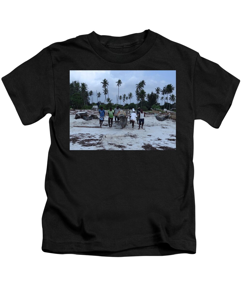 Exploramum Kids T-Shirt featuring the photograph Fisherman heading in from their days catch at sea with a wooden dhow by Exploramum Exploramum