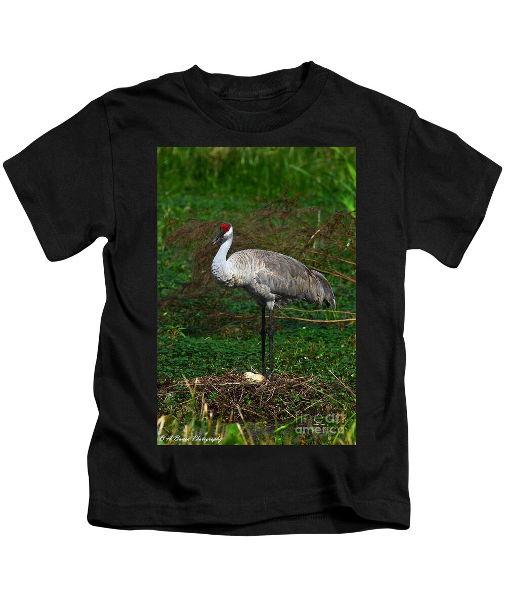 Sandhill Crane Kids T-Shirt featuring the photograph Guarding the nest by Barbara Bowen