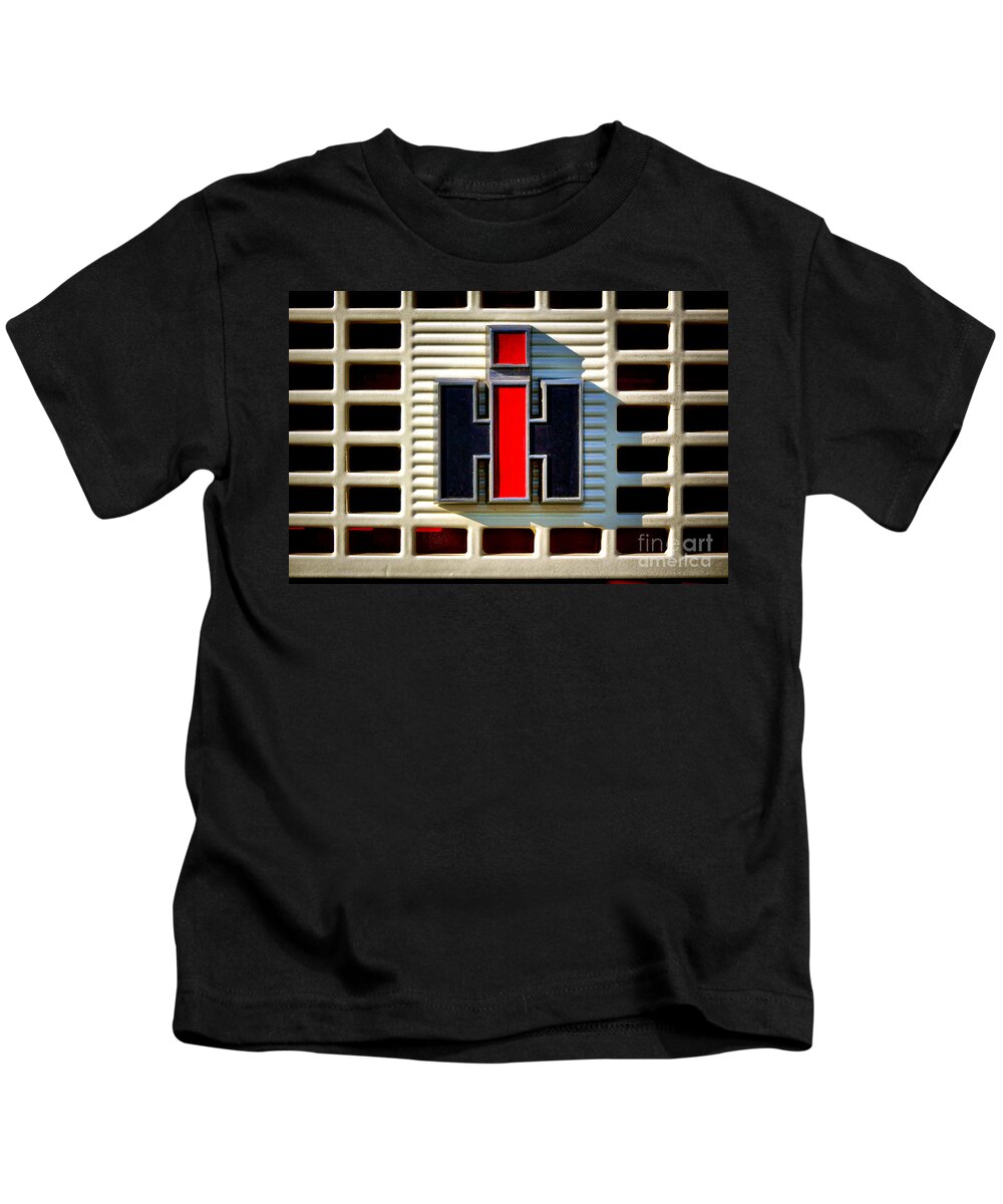 Ih Kids T-Shirt featuring the photograph International Harvester Logo by Olivier Le Queinec