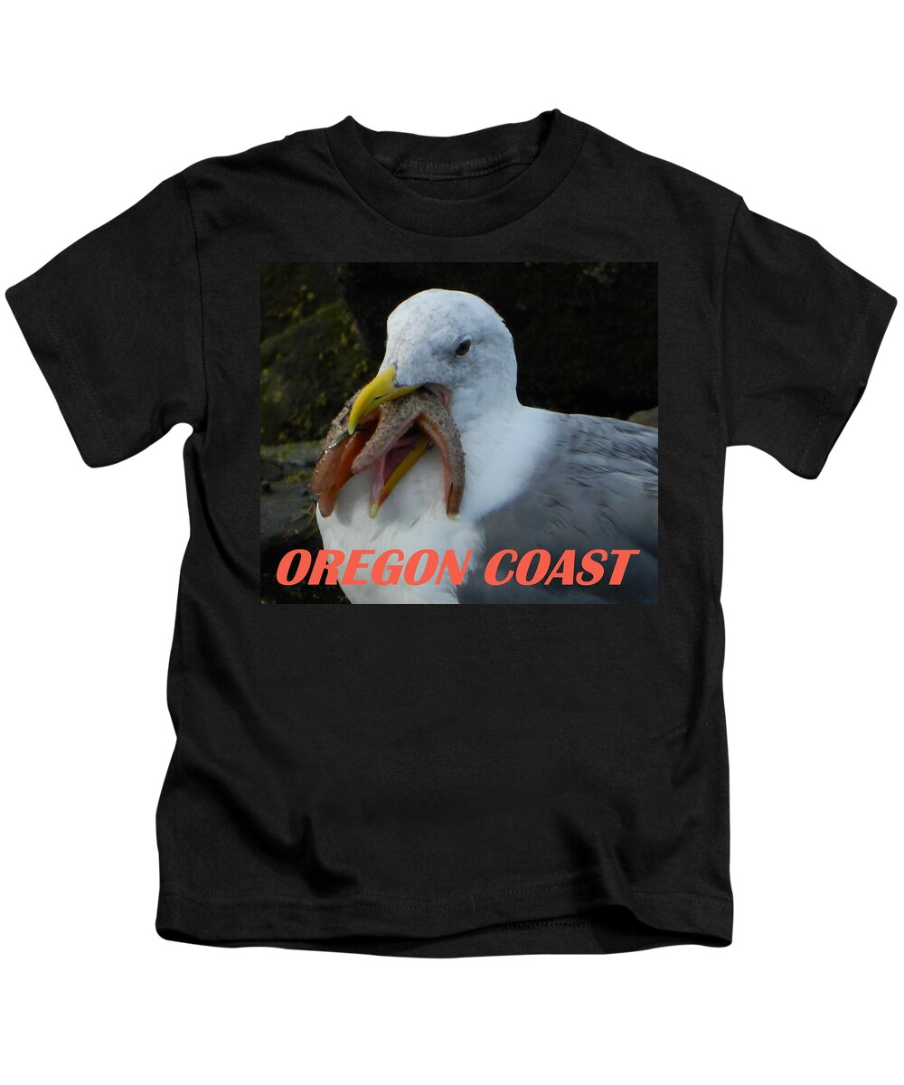 Seagull Kids T-Shirt featuring the photograph Oregon Coast Seagull Eating Starfish by Gallery Of Hope 