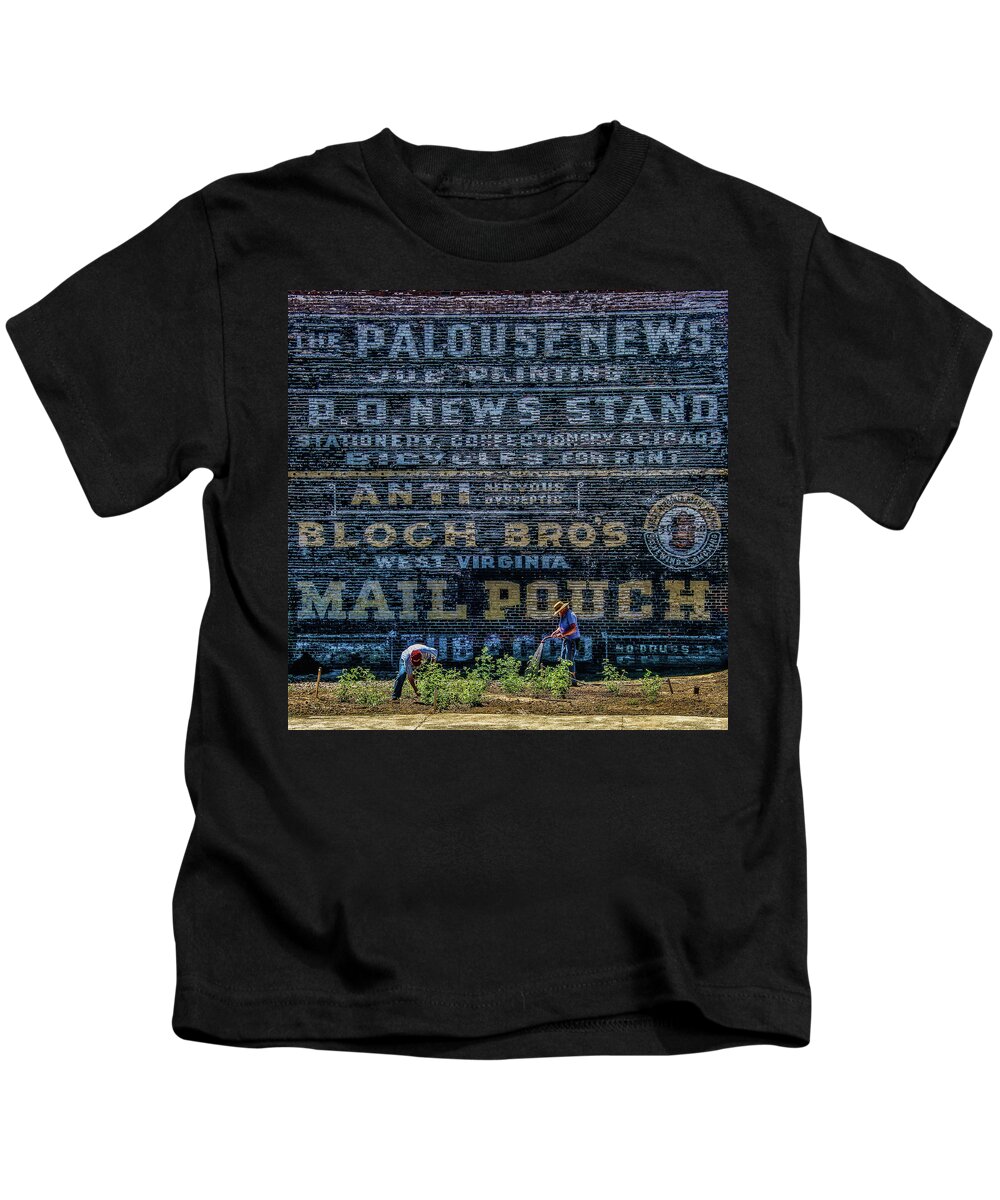Palouse News Kids T-Shirt featuring the photograph Palouse News Painted Sign on Brick by Ed Broberg
