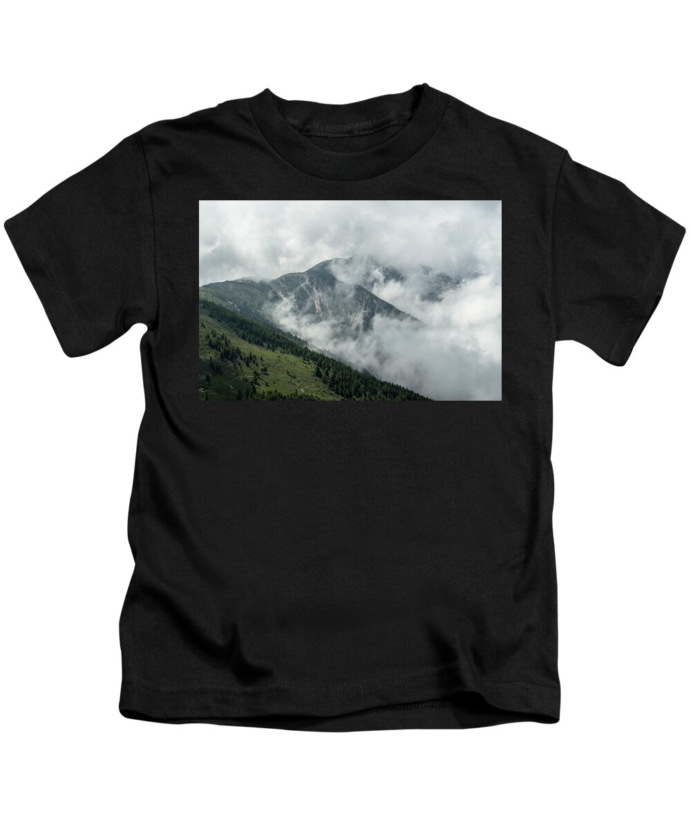 Summit Kids T-Shirt featuring the photograph Top of a Mountain covered with fog by Nicola Aristolao