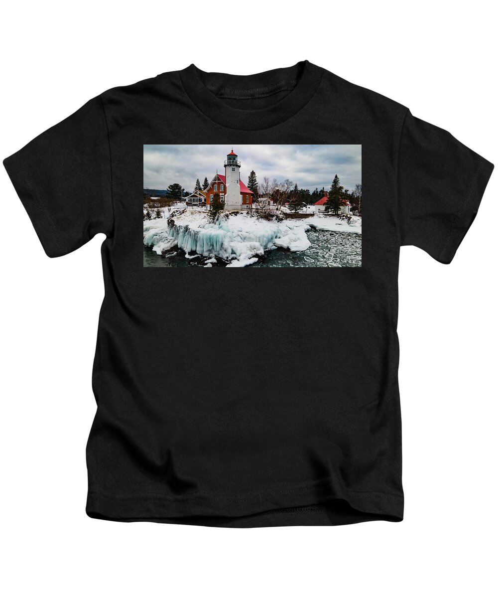 Eagle Harbor Mi Kids T-Shirt featuring the photograph Winter view of Eagle Harbor Lighthouse in Eagle Harbor Michigan by Eldon McGraw