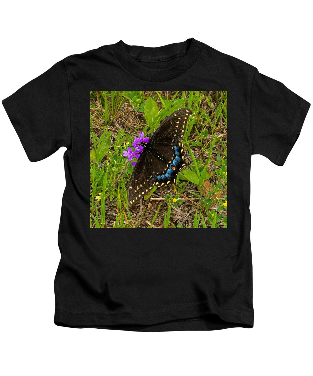 Butterfly Kids T-Shirt featuring the photograph Big Swallow Little Flower by Ivars Vilums
