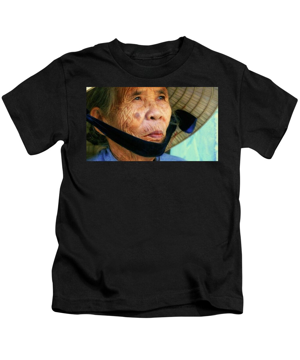 Hat Kids T-Shirt featuring the photograph Old Vietnamese lady with the conical hat by Robert Bociaga
