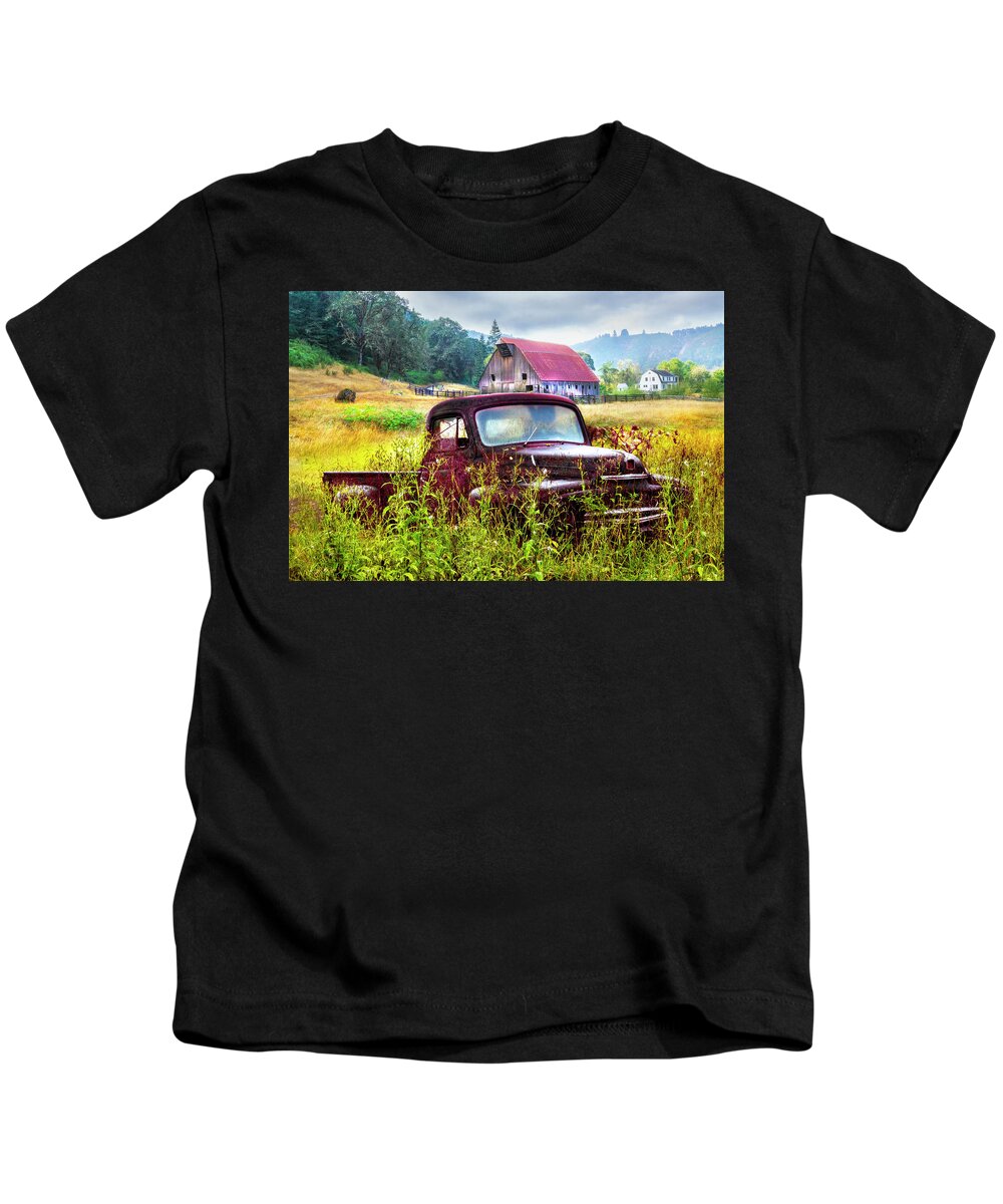 Barns Kids T-Shirt featuring the photograph Rusty Truck Deep in the Wildflowers by Debra and Dave Vanderlaan