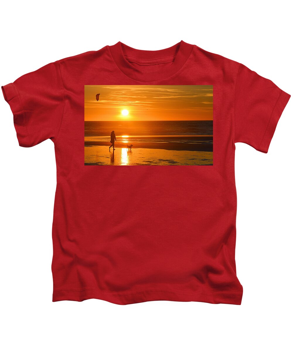 Sunset Kids T-Shirt featuring the photograph Sunset Stroll on the Beach by AJ Schibig