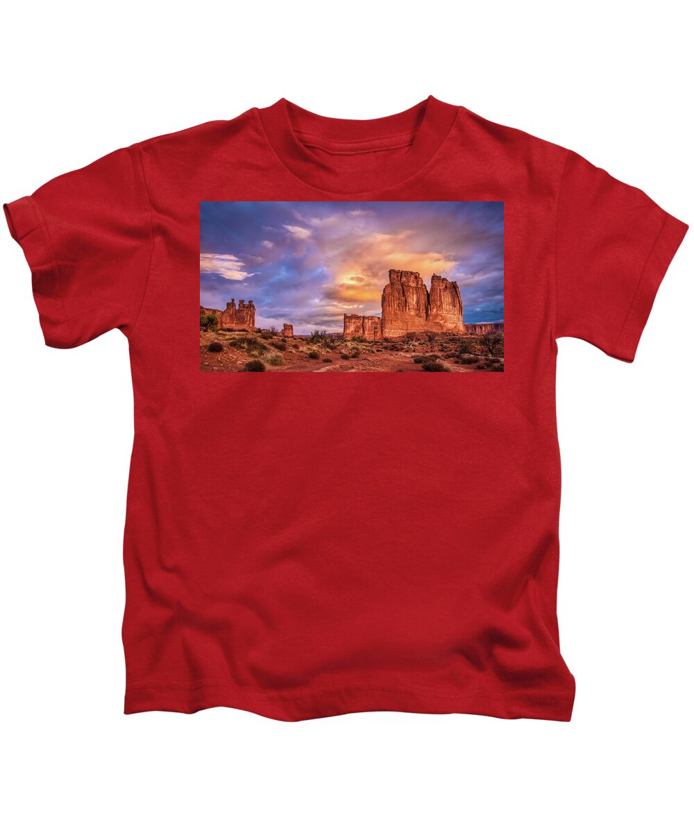 Arches National Park Kids T-Shirt featuring the photograph Sunrise on The Organ, Tower of Babel and the Three Gossips by Brenda Jacobs