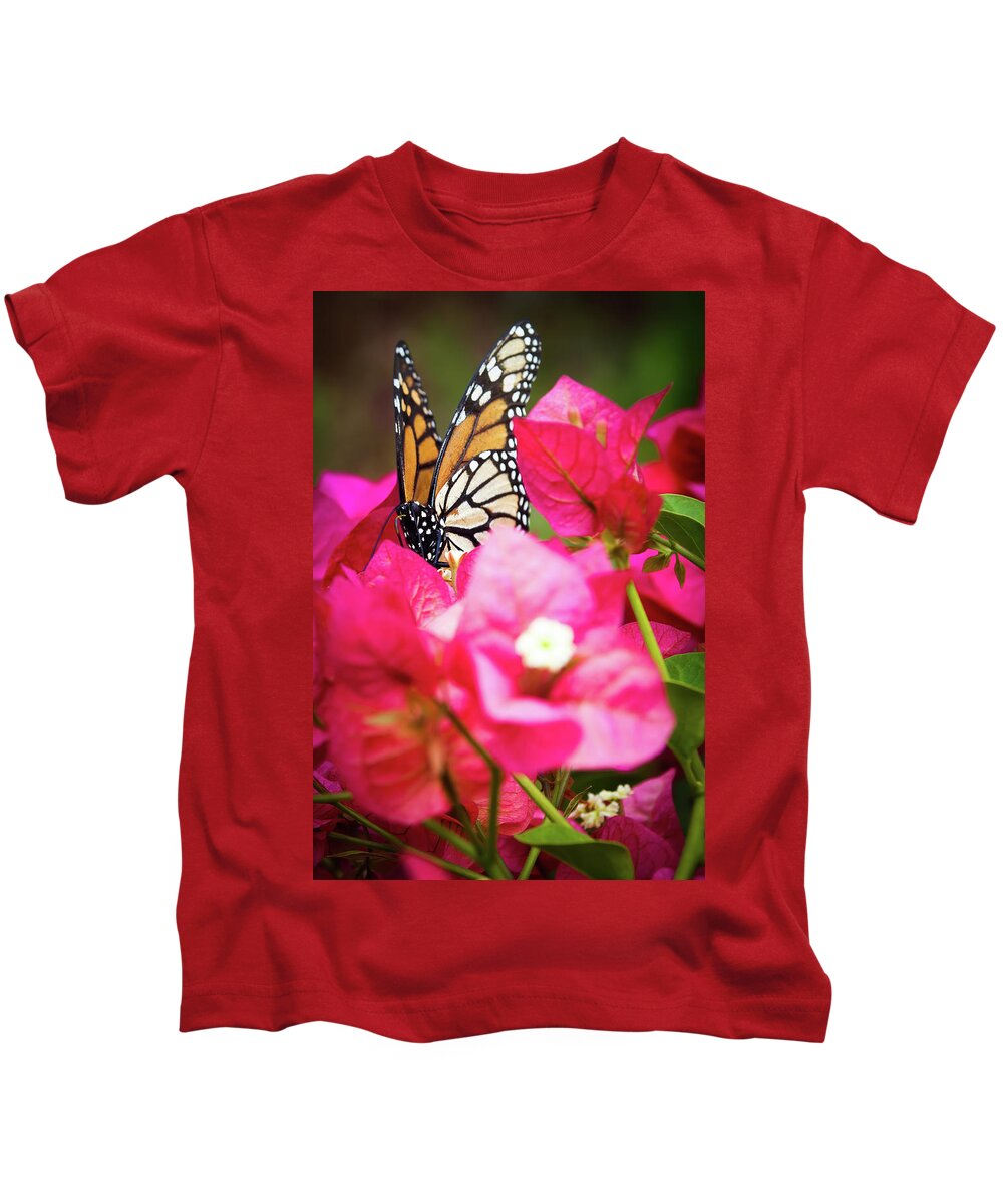 Animal Kids T-Shirt featuring the photograph Monarch butterfly on a red bougainvillea by Jean-Luc Farges