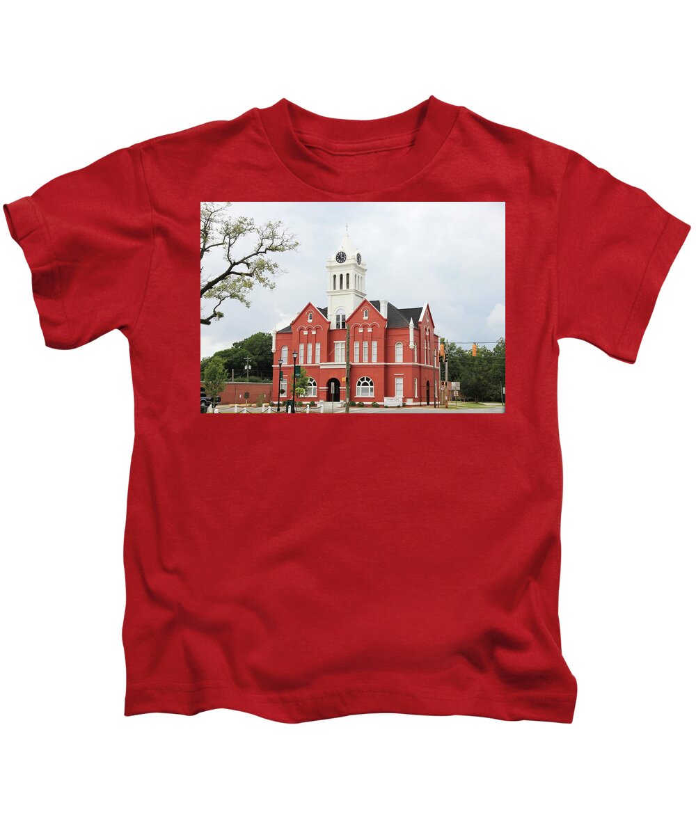 Schley Courthouse Ellaville Schley Ellaville Courthouse Stores Square Caylee Hammock Brent Cobb Kids T-Shirt featuring the photograph Schley County Courthouse 2 by Jerry Battle