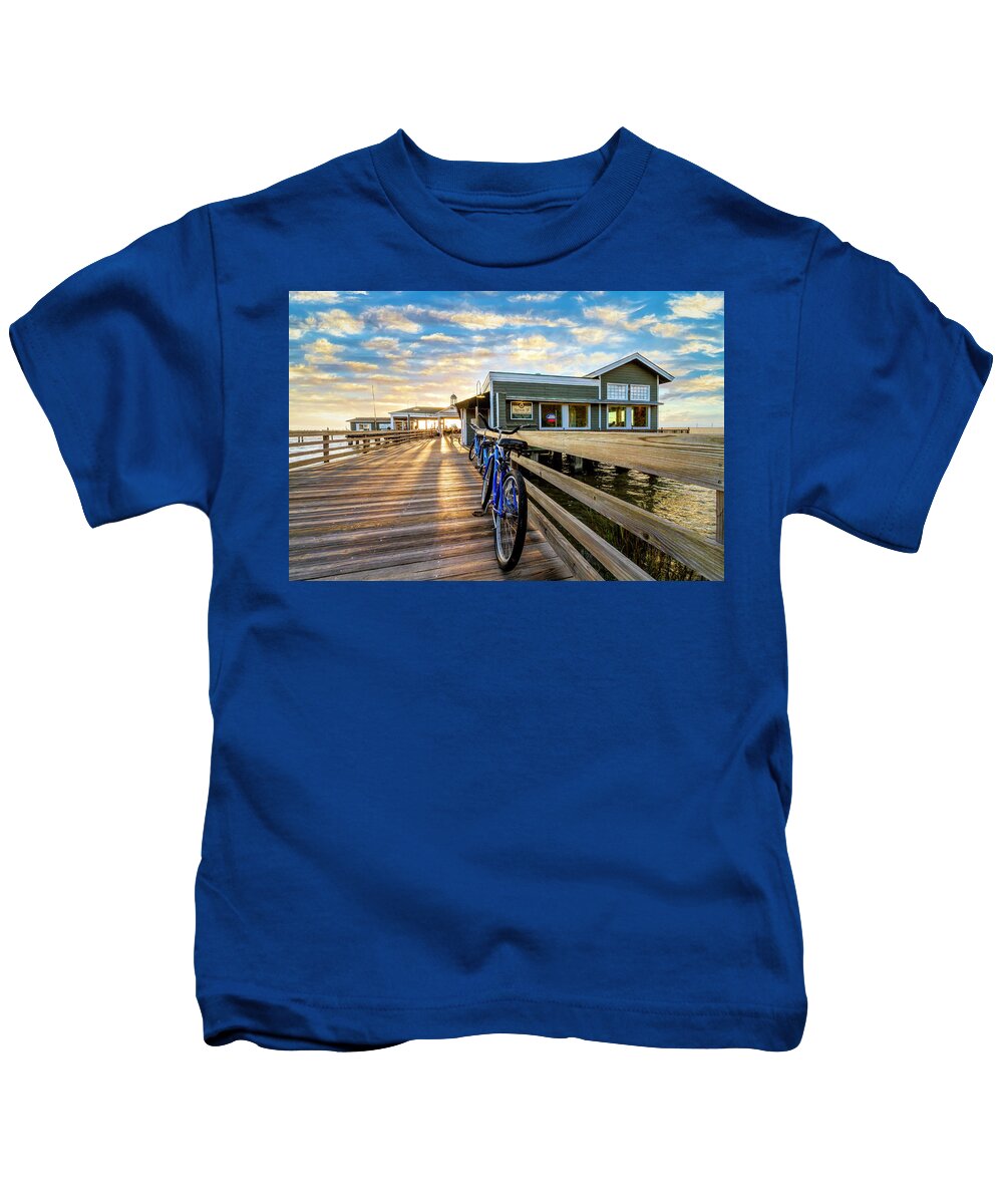 Clouds Kids T-Shirt featuring the photograph Blue Bicycles on the Jekyll Island Boardwalk Pier by Debra and Dave Vanderlaan