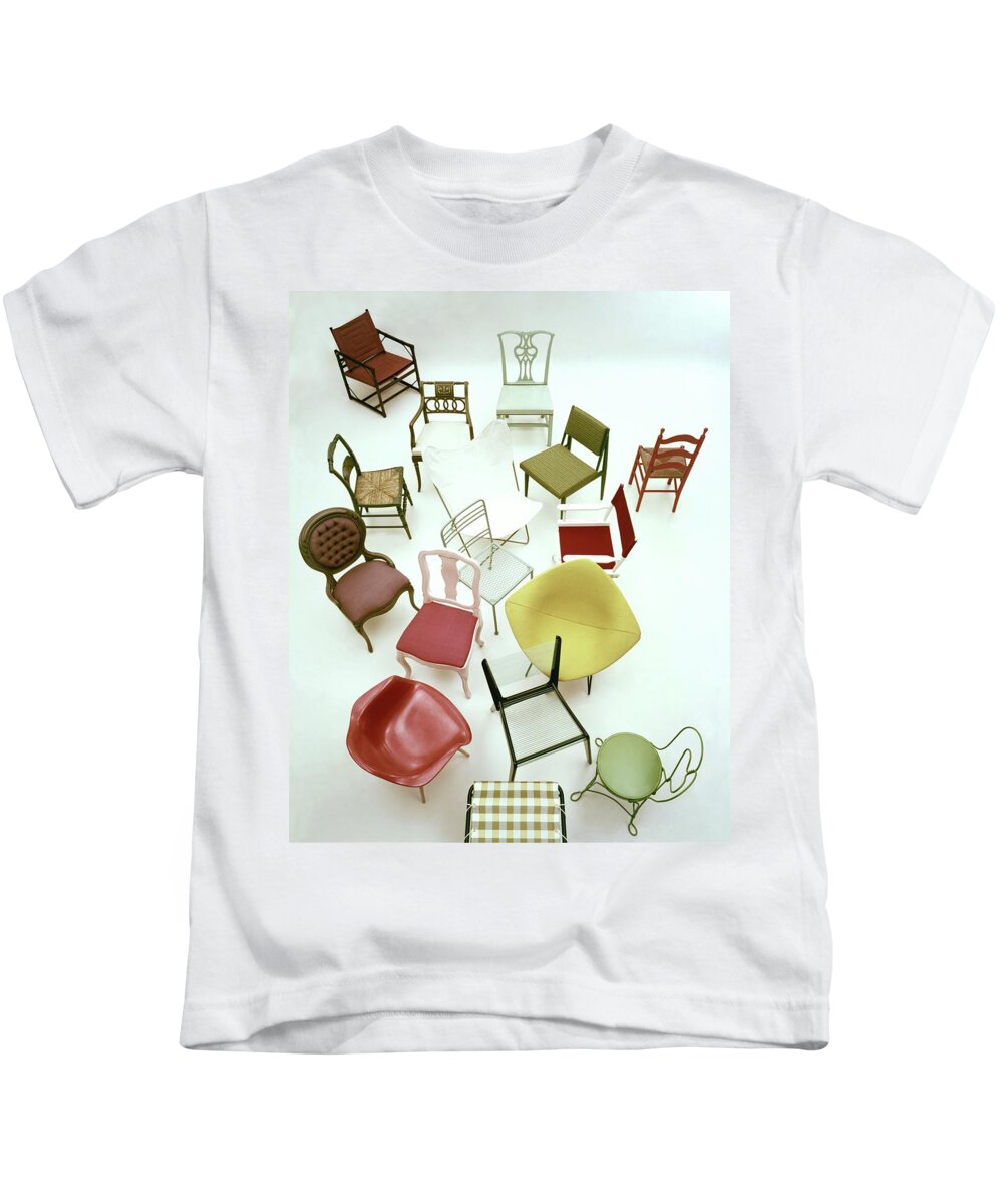 Renovation Kids T-Shirt featuring the photograph A Large Group Of Chairs by Herbert Matter