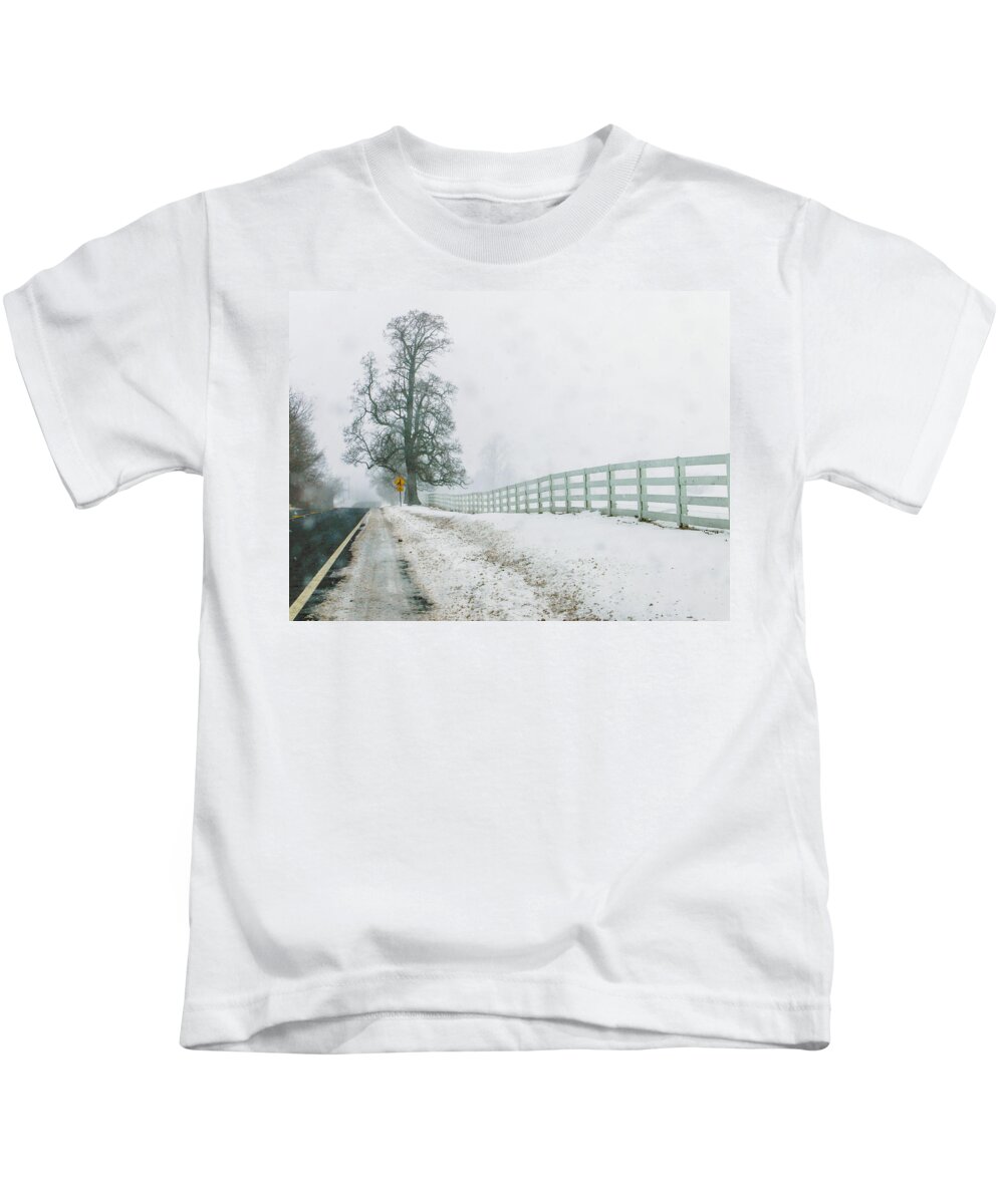 Nature Kids T-Shirt featuring the photograph Big Tree in Snow Storm by Louis Dallara