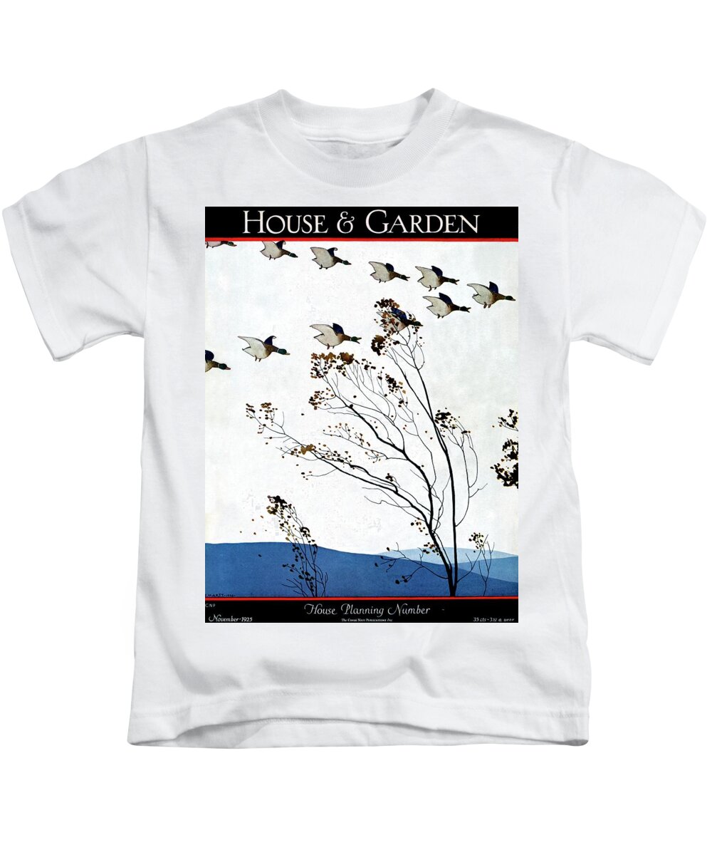 House And Garden Kids T-Shirt featuring the photograph Canadian Geese Over Brown-leafed Trees by Andre E. Marty