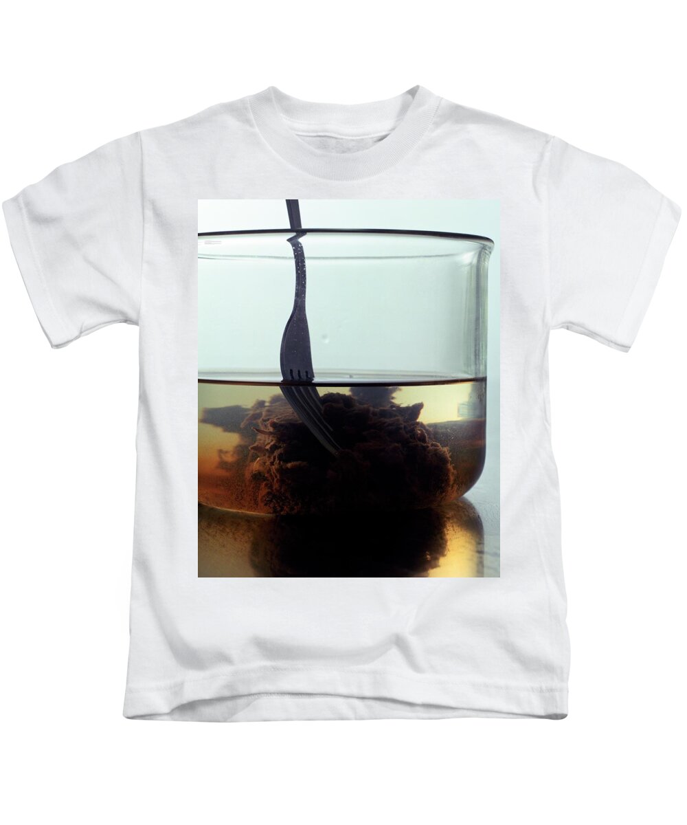 Cooking Kids T-Shirt featuring the photograph Tamarind Powder Floating In Water by Romulo Yanes