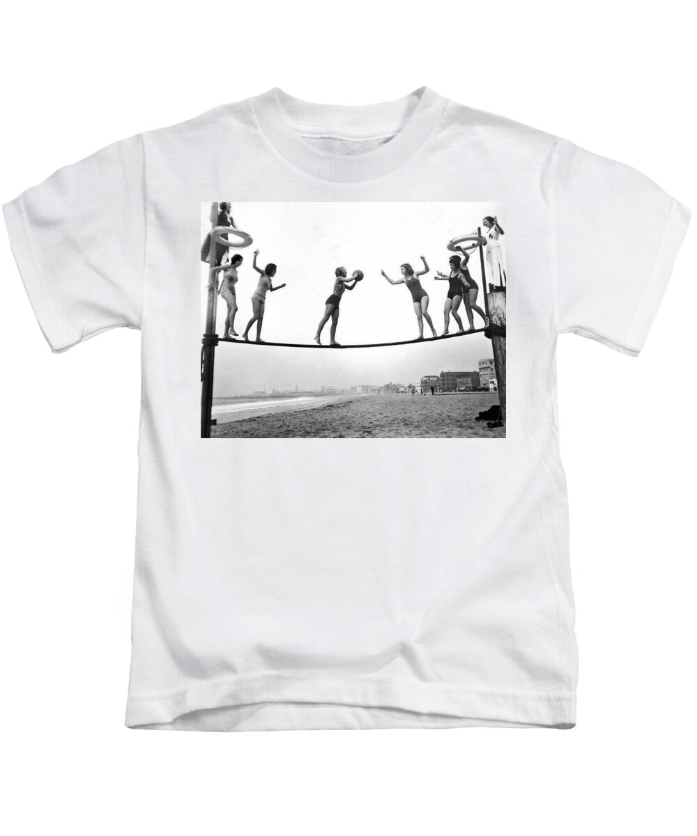 1929 Kids T-Shirt featuring the photograph Women Play Beach Basketball by Underwood Archives