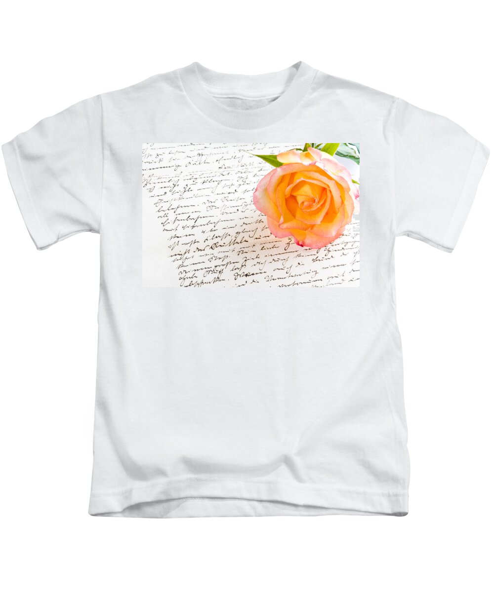 Alliance Kids T-Shirt featuring the photograph Red yellow rose over a hand written love letter by U Schade