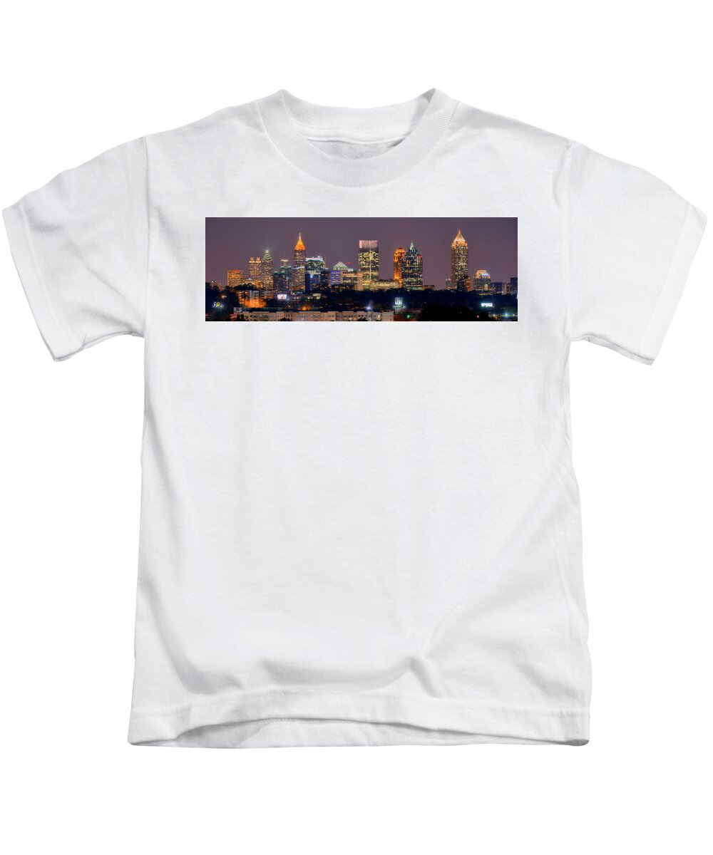 #faatoppicks Kids T-Shirt featuring the photograph Atlanta Skyline at Night Downtown Midtown Color Panorama by Jon Holiday