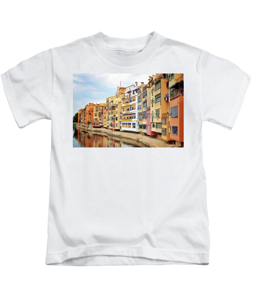 Girona Kids T-Shirt featuring the photograph Picturesque buildings along the river in Girona, Catalonia by GoodMood Art