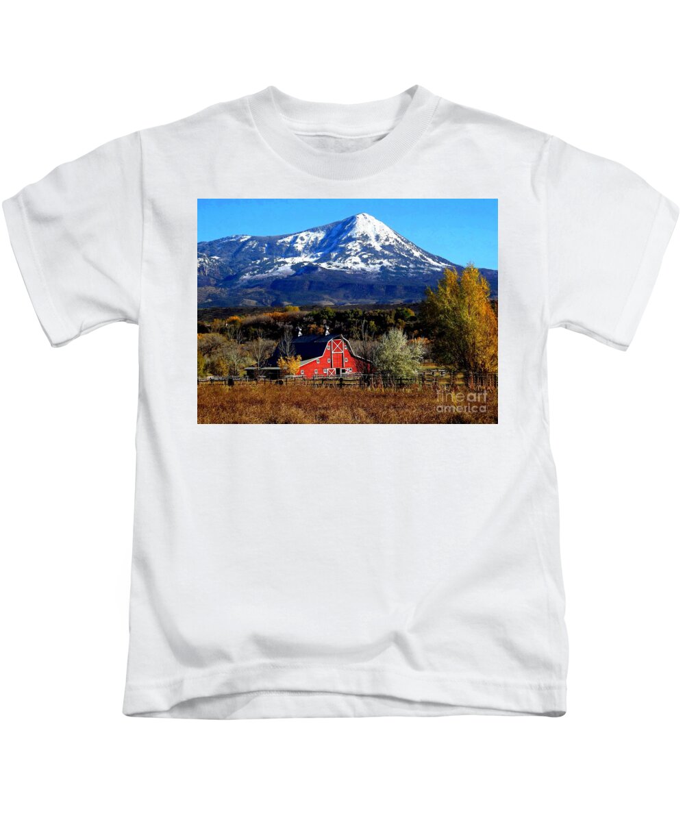 First Snow Sets Off Peak With Red Barn In Fore Ground Paonia Colorado Kids T-Shirt featuring the digital art Red Barn in Paonia Colorado by Annie Gibbons