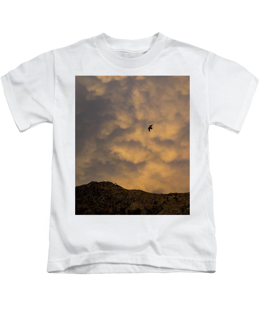 Sunset Kids T-Shirt featuring the photograph Riding the storm by Martin Gollery