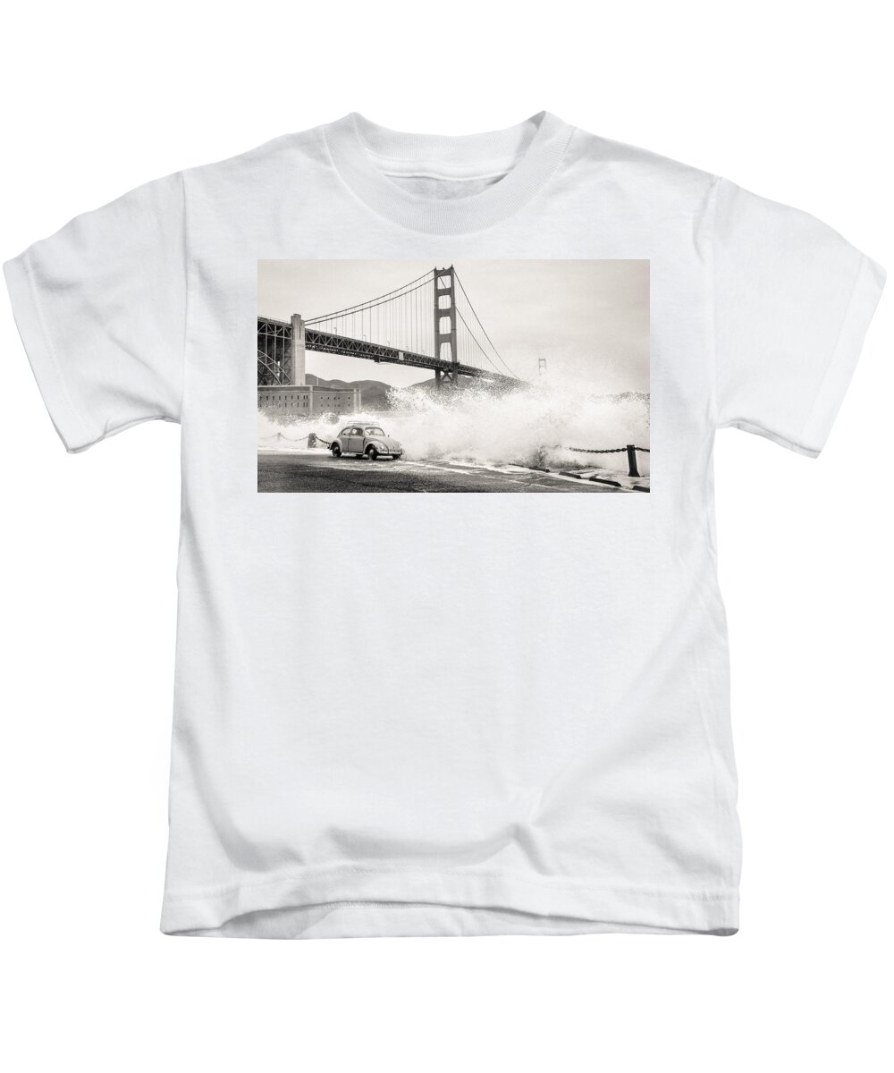 Richard Kimbrough Kids T-Shirt featuring the photograph Waves Crash over a Vintage Beetle in Front of the Golden Gate Bridge San Francisco California BW by Richard Kimbrough