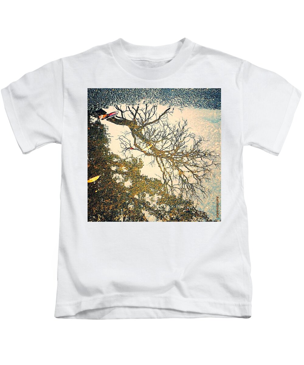 Raining Kids T-Shirt featuring the photograph While Everyone Watches Football On Tv by Austin Tuxedo Cat